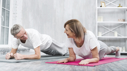 ورزش senior couple doing yoga together home 23 2148097408 256